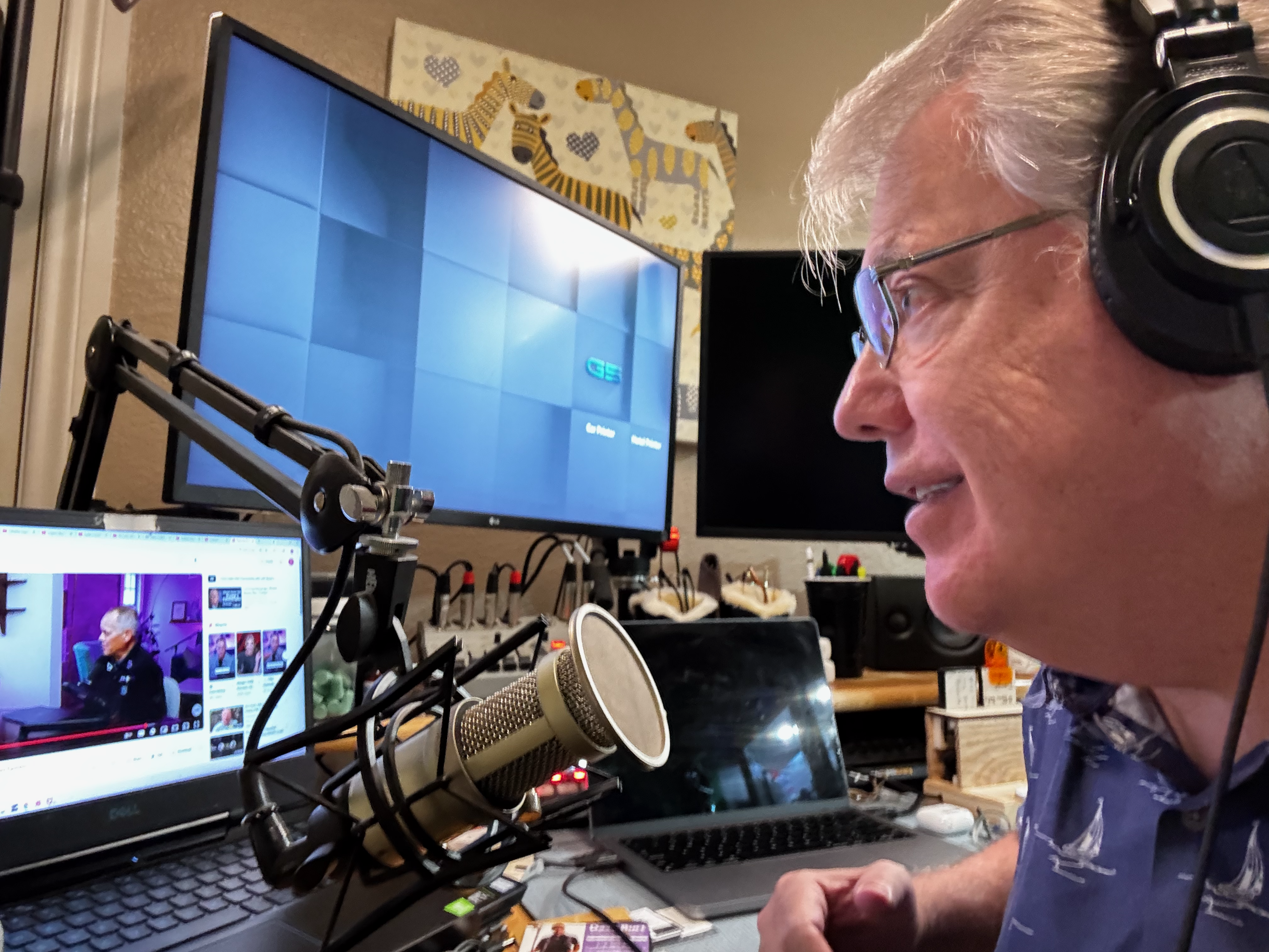 A person recording a voice-over in a studio setting.