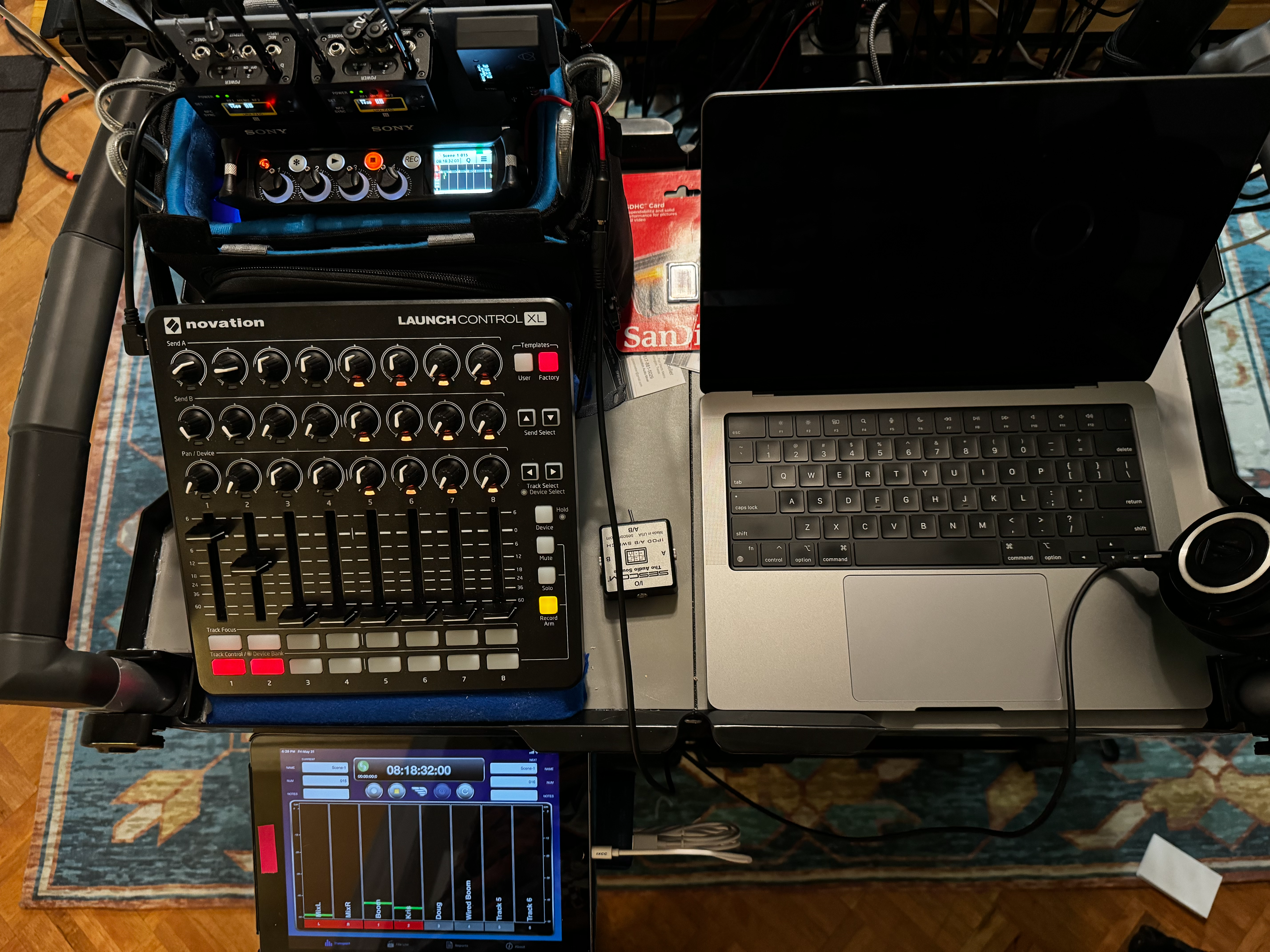 A professional audio recording cart with equipment.